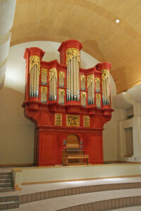 Red organ with gold pipes