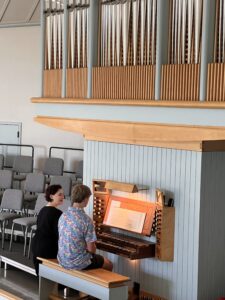 Teacher and student at organ.