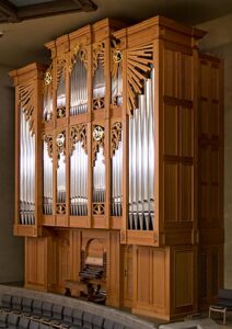 Wood organ with silver pipes.